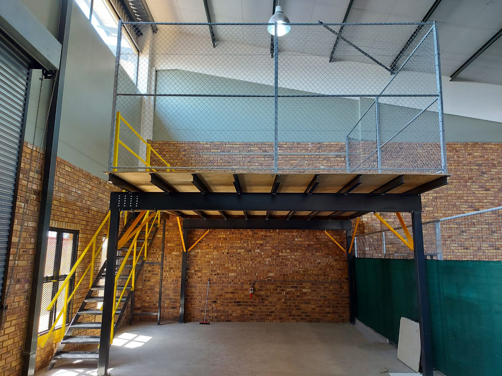 Mezzanine Floor with handrails and staircase.